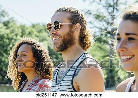 Close up of smiling friends View Large Photo Image Stock Photo - Close up of smiling friends. Fotosearch