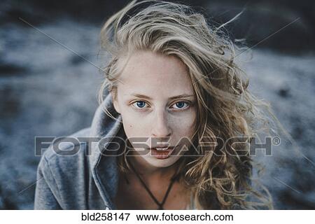 Close up of wind blowing hair of Caucasian woman View Large Photo Image Stock Photo - Close up of wind blowing hair of Caucasian woman. Fotosearch