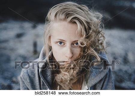 Stock Photo - Close up of wind blowing hair of Caucasian woman. Fotosearch