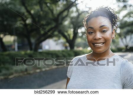 Close up portrait of smiling Black woman View Large Photo Image Stock Photo - Close up portrait of smiling Black woman. Fotosearch