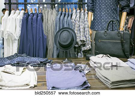 Stock Photo - Clothing and mannequin at retail store. Fotosearch