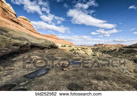 "Clouds in blue sky over desert in Moab, Utah, United States" View Large Photo Image Stock Image - "Clouds in blue sky over desert in Moab, Utah, United States". Fotosearch