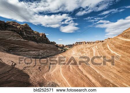 Stock Image - "Clouds over canyon in Moab, Utah, United States". Fotosearch