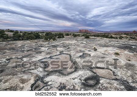 Stock Image - "Clouds over desert in Moab, Utah, United States". Fotosearch