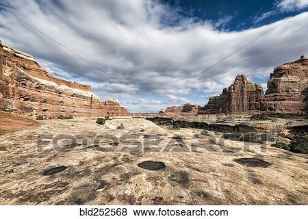 Stock Photo - "Clouds over desert in Moab, Utah, United States". Fotosearch