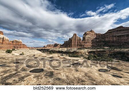 Stock Photo - "Clouds over desert in Moab, Utah, United States". Fotosearch