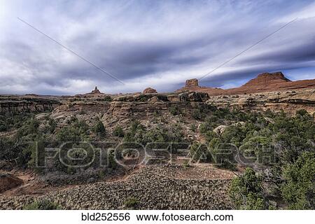 "Clouds over desert in Moab, Utah, United States" View Large Photo Image Stock Photograph - "Clouds over desert in Moab, Utah, United States". Fotosearch