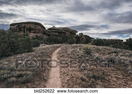 "Clouds over desert path, Moab, Utah, United States" View Large Photo Image Stock Image - "Clouds over desert path, Moab, Utah, United States". Fotosearch