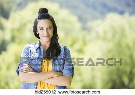 Confident Caucasian woman with arms crossed View Large Photo Image Stock Image - Confident Caucasian woman with arms crossed. Fotosearch