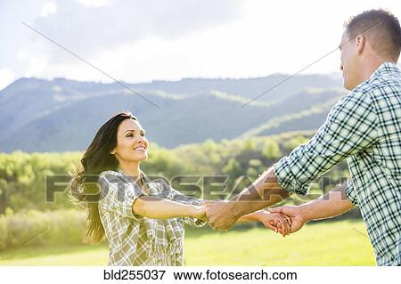 Stock Photo - Couple dancing in park. Fotosearch