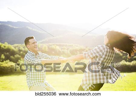 Couple dancing in park View Large Photo Image Stock Photograph - Couple dancing in park. Fotosearch