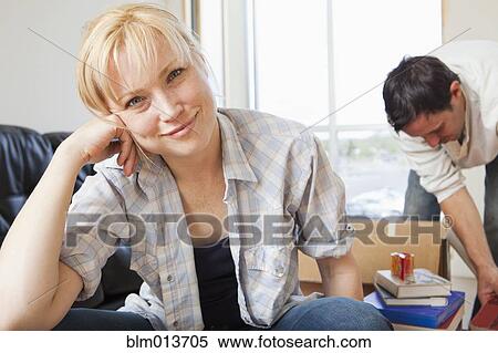 Stock Photography - Couple moving into new house. Fotosearch