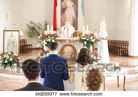Couples waiting in church View Large Photo Image Stock Photo - Couples waiting in church. Fotosearch