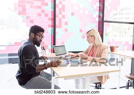 Creative business people using technology at table View Large Photo Image Stock Image - Creative business people using technology at table. Fotosearch