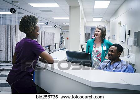 Doctor and nurses talking in hospital View Large Photo Image Stock Photography - Doctor and nurses talking in hospital. Fotosearch