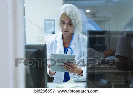 Doctor using digital tablet View Large Photo Image Stock Photo - Doctor using digital tablet. Fotosearch