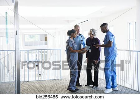 Doctors and nurses discussing digital tablet View Large Photo Image Stock Photography - Doctors and nurses discussing digital tablet. Fotosearch