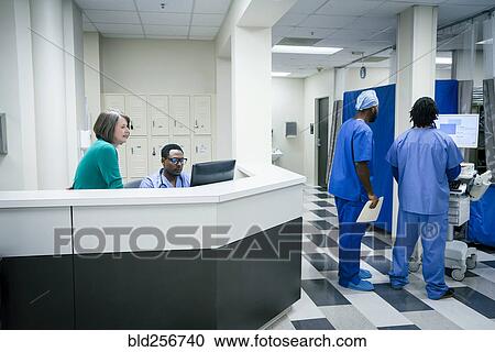 Doctors and nurses using computers in hospital View Large Photo Image Stock Image - Doctors and nurses using computers in hospital. Fotosearch