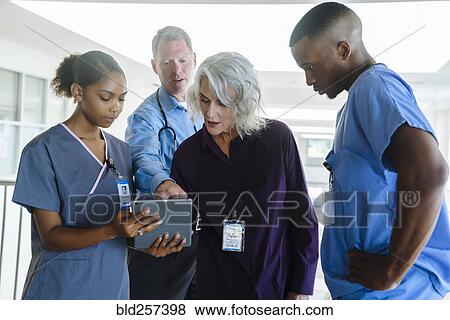 Doctors and nurses using digital tablet View Large Photo Image Stock Photo - Doctors and nurses using digital tablet. Fotosearch