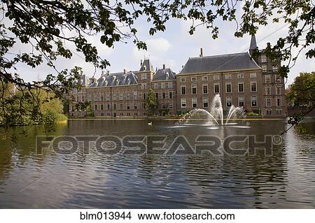 Picture - Dutch building and fountain on pond. Fotosearch