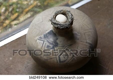 Egg in nest on vase View Large Photo Image Stock Photo - Egg in nest on vase. Fotosearch