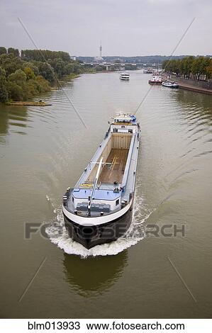 Stock Image - Empty boat on Dutch river. Fotosearch