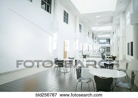 Stock Photo - Empty table and chairs in lobby. Fotosearch