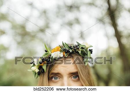 Stock Photograph - Eyes of Middle Eastern woman wearing flower crown. Fotosearch