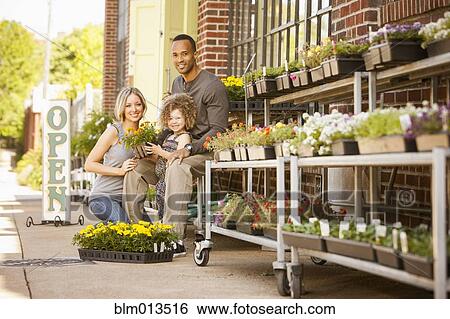 Stock Photograph - Family at florist shop. Fotosearch