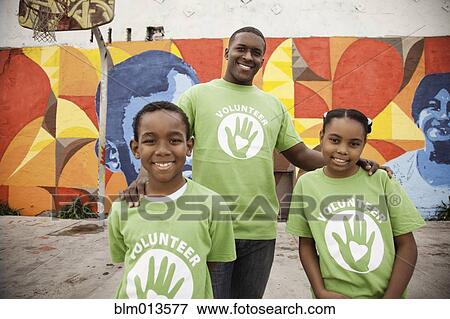 Father and children volunteering together View Large Photo Image Stock Photo - Father and children volunteering together. Fotosearch