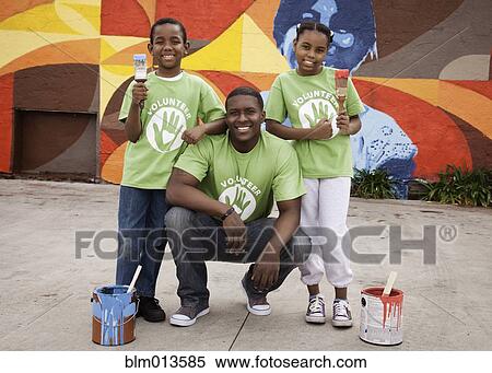 Father and children volunteering together View Large Photo Image Stock Photography - Father and children volunteering together. Fotosearch