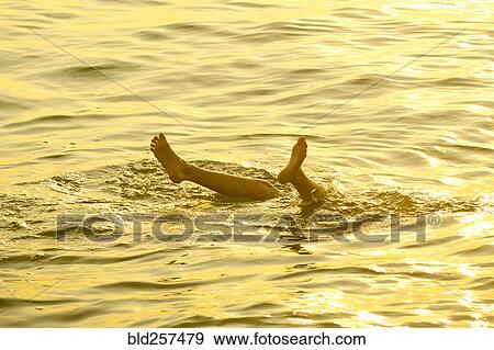 Feet of Caucasian boy sticking out of water View Large Photo Image Stock Photo - Feet of Caucasian boy sticking out of water. Fotosearch
