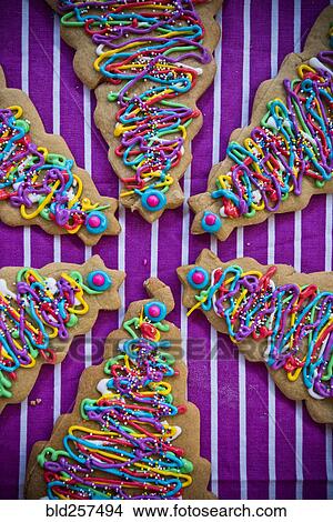 Picture - Festive Christmas tree cookies with multicolor icing. Fotosearch