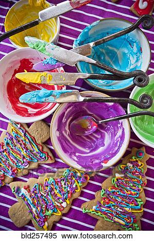 Stock Photography - Festive Christmas tree cookies with multicolor icing. Fotosearch