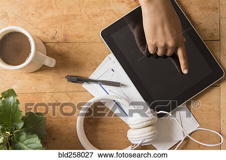Finger of African American woman touching digital tablet View Large Photo Image Stock Photo - Finger of African American woman touching digital tablet. Fotosearch