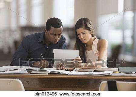 Friends studying with digital tablet View Large Photo Image Stock Photograph - Friends studying with digital tablet. Fotosearch