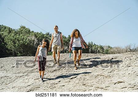Stock Image - Friends walking outdoors. Fotosearch