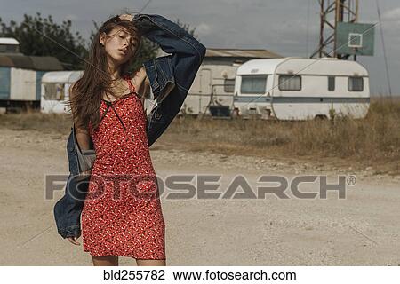 Frustrated Caucasian woman standing near trailers View Large Photo Image Stock Image - Frustrated Caucasian woman standing near trailers. Fotosearch