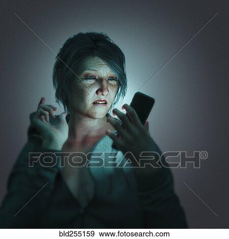 Stock Photo - Frustrated woman texting on cell phone. Fotosearch