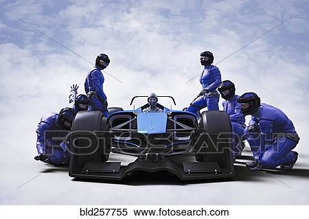 Stock Photography - Futuristic pit crew servicing race car. Fotosearch