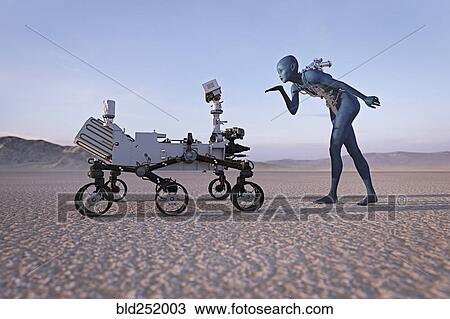 Futuristic woman blowing a kiss to robot in desert View Large Photo Image Stock Image - Futuristic woman blowing a kiss to robot in desert. Fotosearch