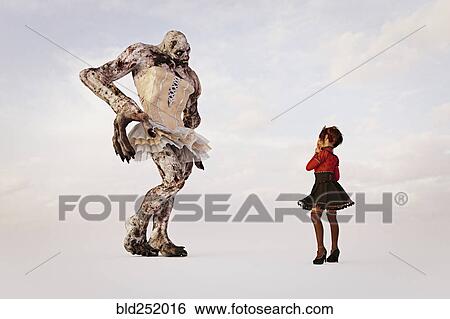 Stock Photograph - Girl examining alien wearing dress. Fotosearch