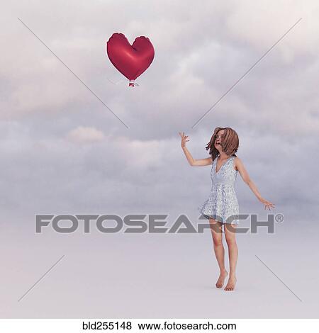 Stock Photo - Girl releasing heart-shape balloon into sky. Fotosearch