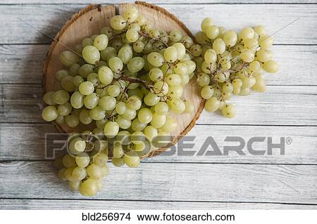 Green grapes on cutting board View Large Photo Image Picture - Green grapes on cutting board. Fotosearch