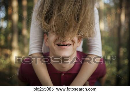 Hair of woman covering face of man View Large Photo Image Stock Photography - Hair of woman covering face of man. Fotosearch