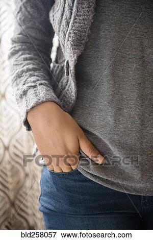 Hand of African American woman in jeans pocket View Large Photo Image Stock Photo - Hand of African American woman in jeans pocket. Fotosearch