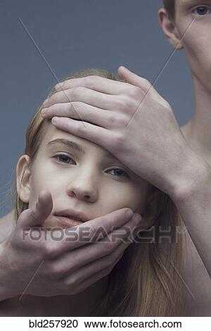 Hands of Caucasian man on face of woman View Large Photo Image Stock Image - Hands of Caucasian man on face of woman. Fotosearch