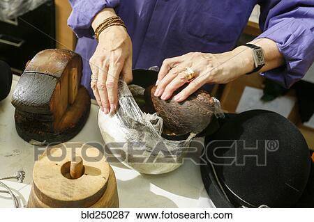 Stock Photo - Hands of woman creating hat. Fotosearch