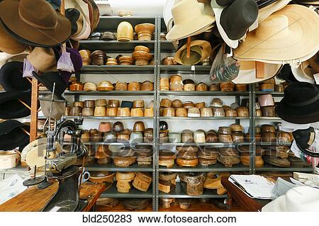Stock Image - Hats and bowls in retail store. Fotosearch