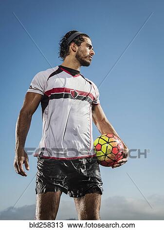Hispanic man holding soccer ball View Large Photo Image Stock Image - Hispanic man holding soccer ball. Fotosearch
